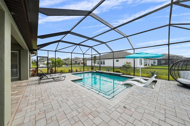 outdoor pool with a residential view, glass enclosure, and a patio