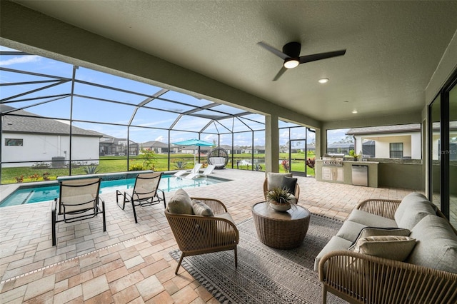 view of patio featuring ceiling fan, an outdoor hangout area, area for grilling, and glass enclosure