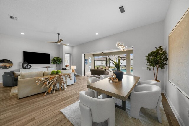 dining area with baseboards, recessed lighting, visible vents, and light wood-type flooring