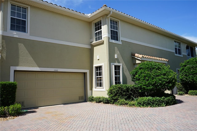 view of front of property with a garage