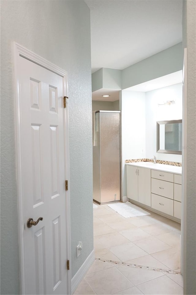 bathroom with vanity and walk in shower