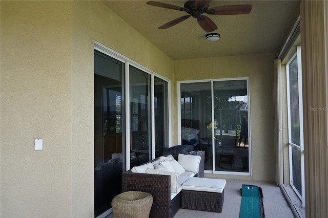 exterior space with ceiling fan