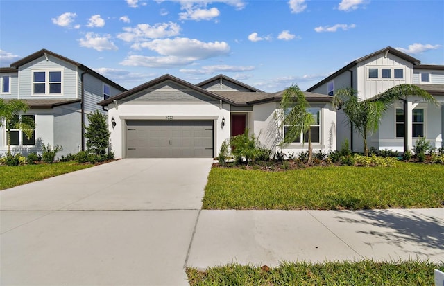 view of front of property featuring a garage and a front yard