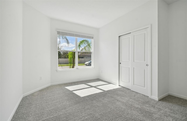 unfurnished bedroom featuring a closet and carpet