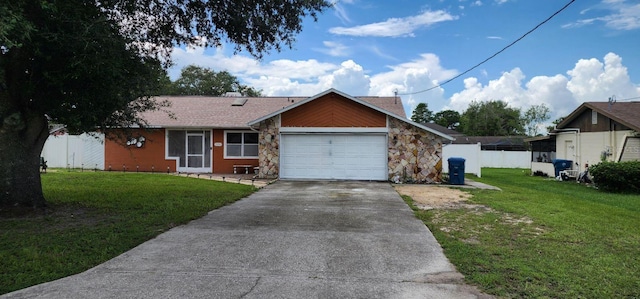 view of front of property featuring a garage and a front yard