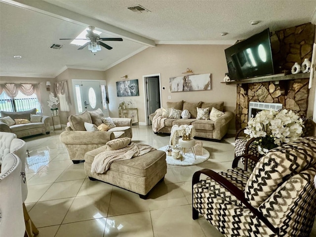 living room featuring a fireplace, a textured ceiling, ceiling fan, vaulted ceiling with beams, and light tile patterned flooring