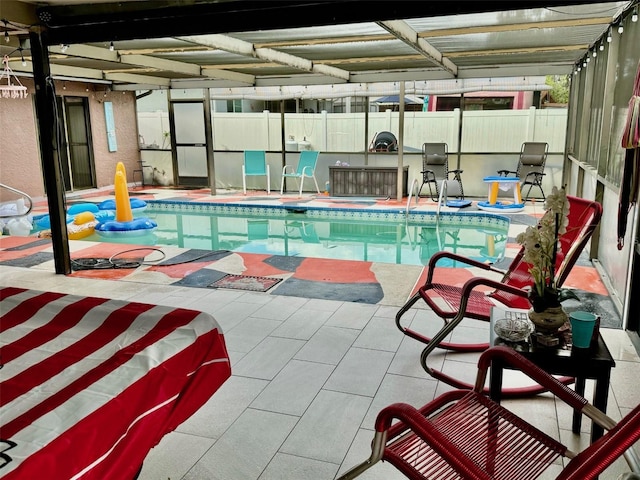 view of swimming pool with a patio area