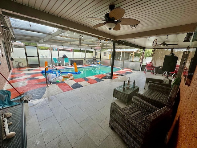 view of swimming pool featuring ceiling fan, a patio area, and an outdoor living space