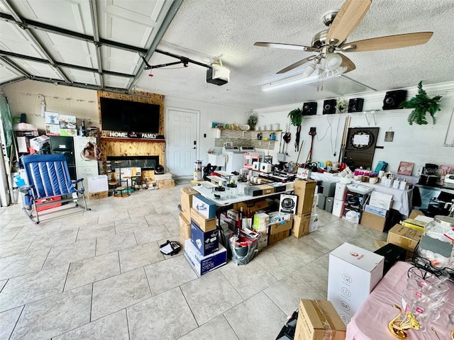 misc room with washer / clothes dryer, ceiling fan, and a textured ceiling