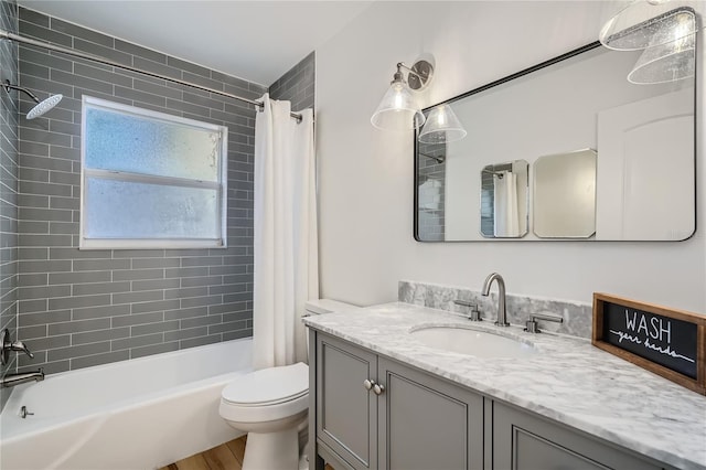 full bathroom with vanity, toilet, wood-type flooring, and shower / tub combo with curtain