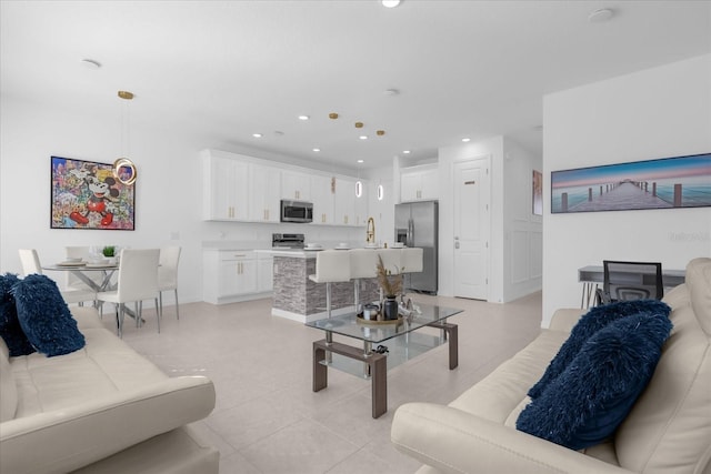 living room with sink and light tile patterned floors