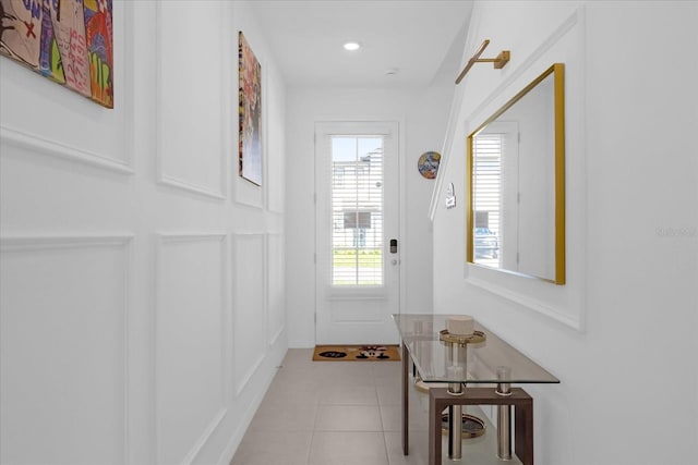 entryway with light tile patterned floors