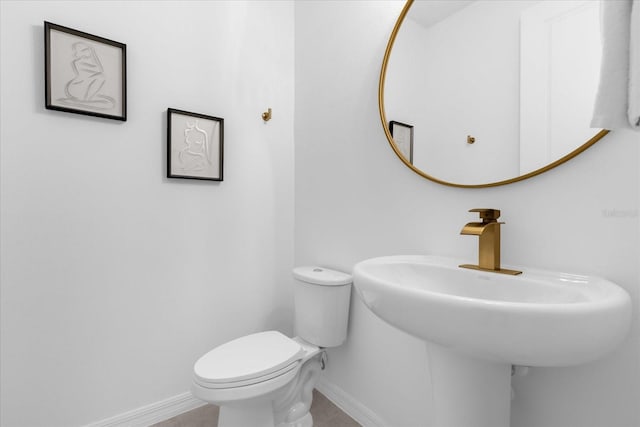 bathroom with toilet and sink