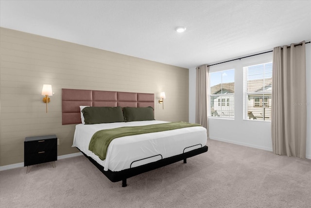 bedroom featuring light colored carpet