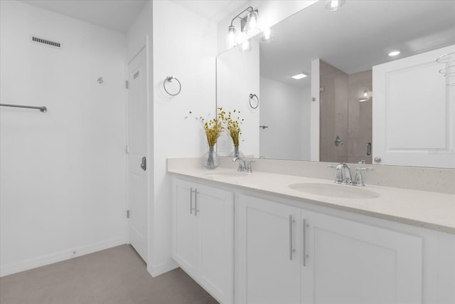 bathroom with an enclosed shower and vanity