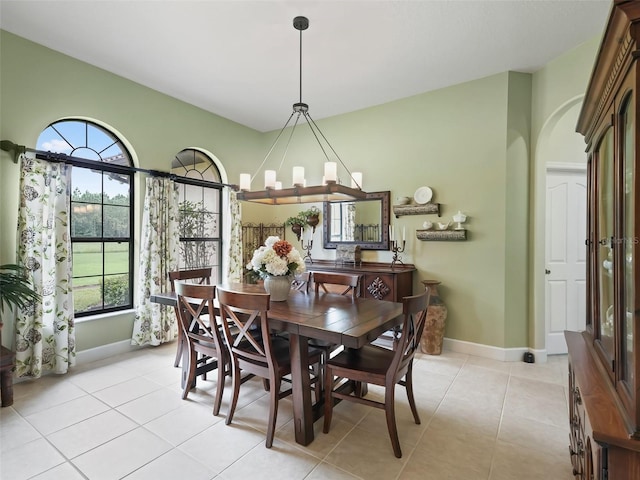 tiled dining area with a notable chandelier