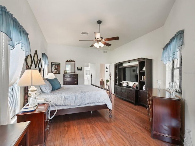 bedroom with ceiling fan and hardwood / wood-style floors