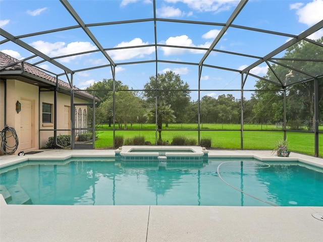 view of swimming pool featuring an in ground hot tub and a lanai