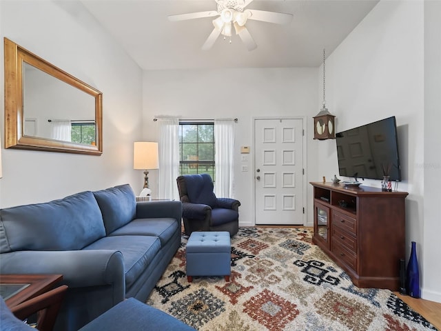 living room featuring ceiling fan and wood-type flooring