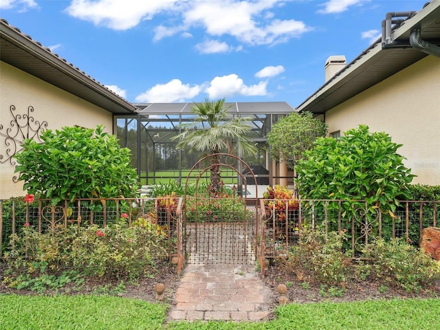 view of yard featuring glass enclosure