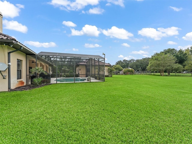 view of yard with glass enclosure