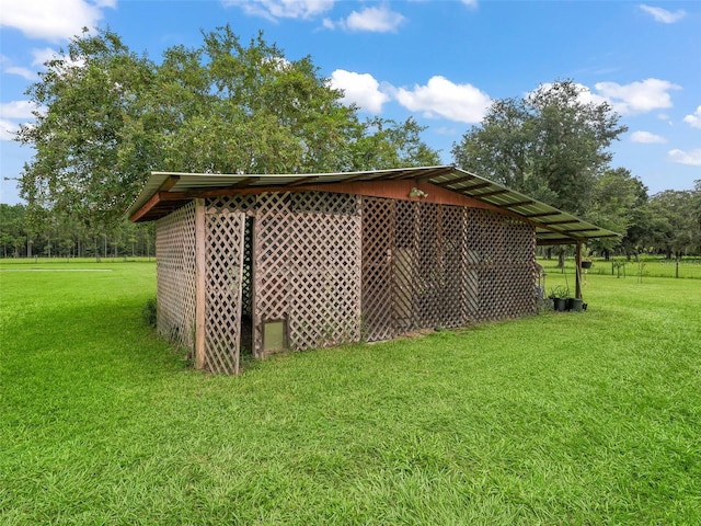 view of outdoor structure with a yard