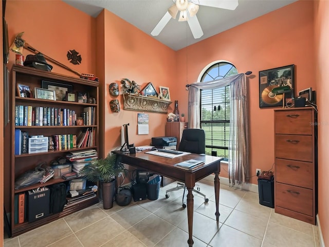 tiled office featuring ceiling fan