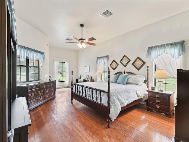 bedroom with ceiling fan and dark hardwood / wood-style floors