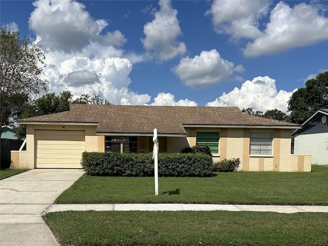 single story home featuring a front lawn and a garage