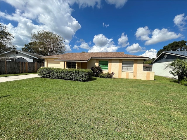 single story home featuring a front lawn