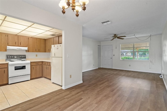 kitchen featuring a textured ceiling, ceiling fan with notable chandelier, light hardwood / wood-style floors, and white appliances