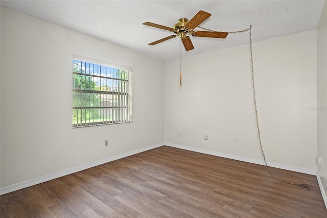 unfurnished room with hardwood / wood-style flooring, ceiling fan, and a textured ceiling