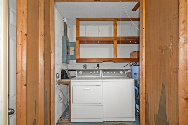 laundry room featuring washer and dryer and electric panel