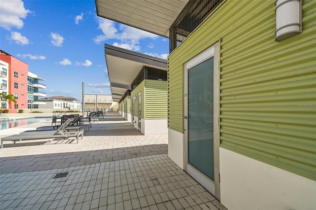 view of patio featuring a community pool