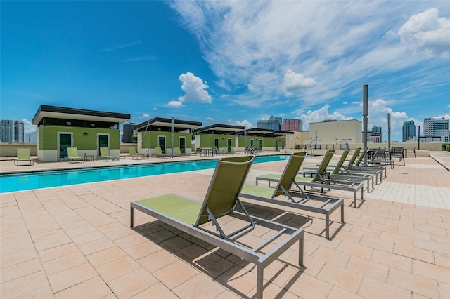 view of swimming pool with a patio