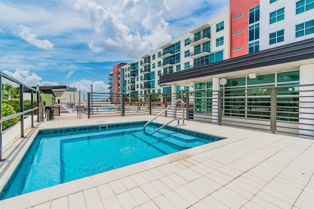 view of swimming pool with a patio area