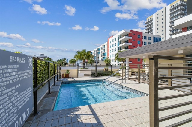 view of swimming pool featuring a patio area