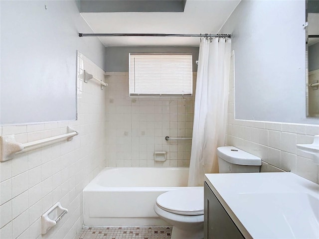 full bathroom with vanity, tile walls, tile patterned floors, shower / bath combination with curtain, and toilet