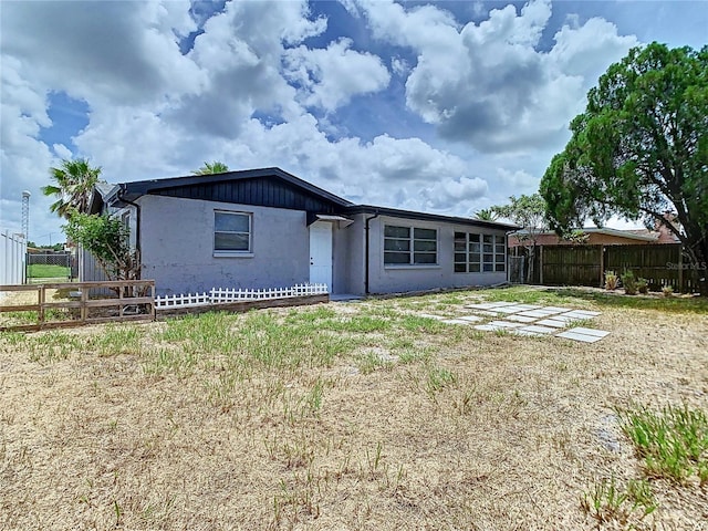 back of house with a yard