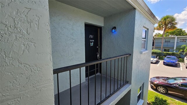 doorway to property with a balcony