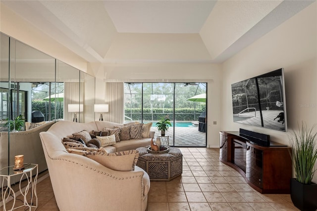 tiled living room with a raised ceiling