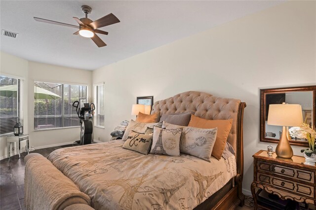 bedroom with ceiling fan and hardwood / wood-style flooring