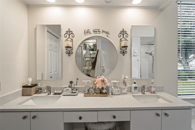 bathroom with vanity and ornamental molding