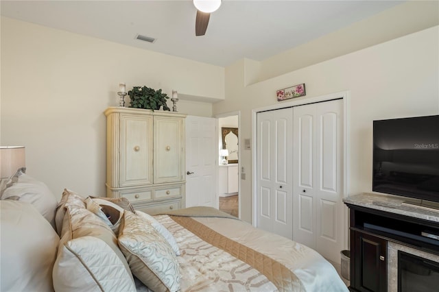 bedroom featuring ceiling fan and a closet