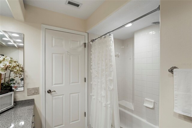 bathroom featuring shower / tub combo with curtain