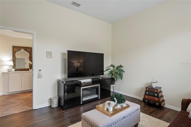 living room with dark hardwood / wood-style floors