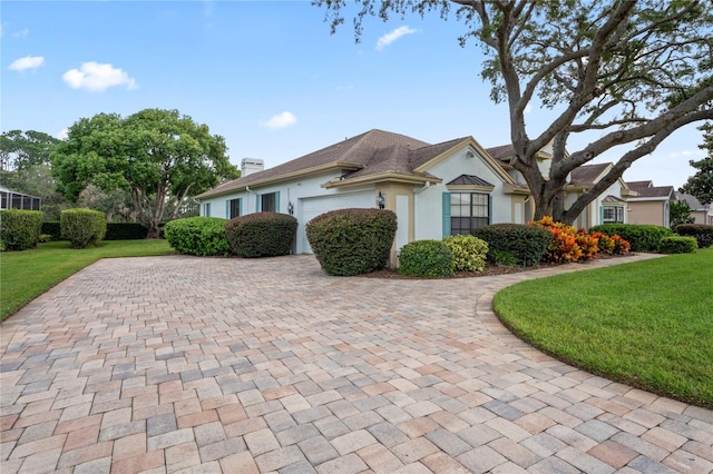 view of front of house featuring a garage and a front yard