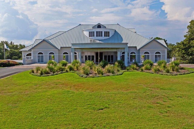 view of front facade with a garage and a front yard