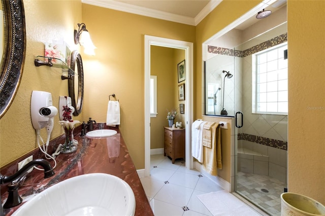 bathroom featuring crown molding, tile patterned floors, an enclosed shower, and vanity