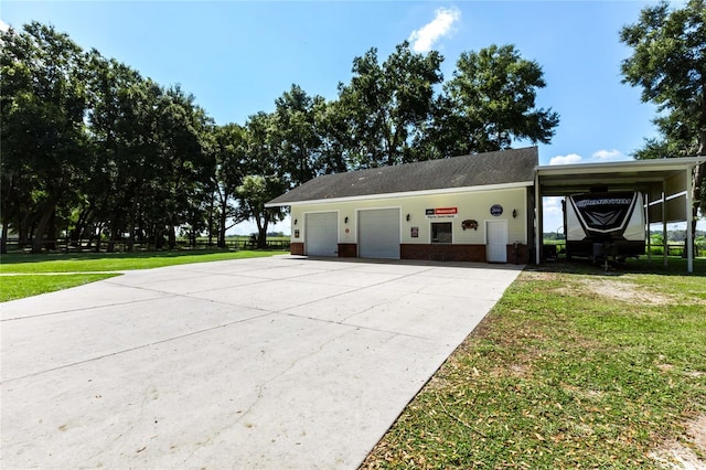 ranch-style house with a garage and a front lawn